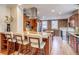 Open kitchen with stainless steel appliances, granite countertops, and a breakfast bar at 840 S Corona St, Denver, CO 80209