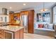 Well-appointed kitchen featuring stainless steel appliances and a large island with wine cooler at 840 S Corona St, Denver, CO 80209