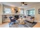 Inviting living room with a decorative fireplace, built-in shelves, and lots of natural light at 840 S Corona St, Denver, CO 80209