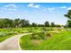 Picturesque park with flower gardens, winding path, and green grass at 840 S Corona St, Denver, CO 80209