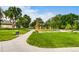 Scenic view of a modern playground and walking path in a green community park at 840 S Corona St, Denver, CO 80209