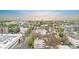 A view of a vibrant city neighborhood with tree-lined streets and a mix of buildings at 624 E 18Th Ave # 3, Denver, CO 80203