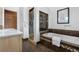 This bathroom has a tub and shower with tile accents and neutral wall paint at 624 E 18Th Ave # 3, Denver, CO 80203