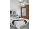 Bedroom with exposed brick and a hanging light fixture at 624 E 18Th Ave # 3, Denver, CO 80203