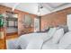 Bedroom with exposed brick, stylish decor, and closet access at 624 E 18Th Ave # 3, Denver, CO 80203