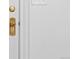 Close up of a white door with a decorative gold handle and keyhole at 624 E 18Th Ave # 3, Denver, CO 80203