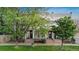 Charming duplex with shared front yard, classic architecture, and inviting entrances framed by trees, perfect for urban living at 624 E 18Th Ave # 3, Denver, CO 80203