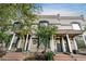 Charming townhouse exterior featuring a classic facade with covered porch and landscaped front yard at 624 E 18Th Ave # 3, Denver, CO 80203