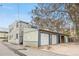 The back of a two story apartment building has individual garages at 624 E 18Th Ave # 3, Denver, CO 80203