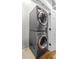 Stacked front load washer and dryer in laundry area at 624 E 18Th Ave # 3, Denver, CO 80203