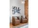 Charming living area with brick accents, stylish seating, hardwood floors, and modern decor at 624 E 18Th Ave # 3, Denver, CO 80203