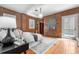 Bedroom featuring exposed brick, hardwood floors, and a modern decor at 624 E 18Th Ave # 3, Denver, CO 80203