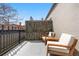 Cozy patio with comfortable seating, a privacy screen and city views at 624 E 18Th Ave # 3, Denver, CO 80203