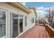 Inviting back deck with sliding glass doors offering seamless indoor-outdoor living and entertaining at 2601 S Kipling Ct, Lakewood, CO 80227