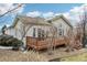 Charming home featuring a wooden deck, perfect for enjoying the outdoors and relaxing in comfort at 2601 S Kipling Ct, Lakewood, CO 80227