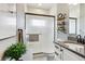 Modern bathroom featuring a glass-enclosed shower and a vanity with storage at 2601 S Kipling Ct, Lakewood, CO 80227