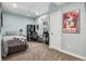 Bedroom with a ceiling fan, neutral walls, and comfortable carpeting at 2601 S Kipling Ct, Lakewood, CO 80227