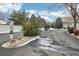 Inviting community entrance featuring lush greenery, providing a sense of privacy and exclusivity at 2601 S Kipling Ct, Lakewood, CO 80227