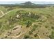 Scenic aerial shot of vast trails and rocky outcrops, set against the backdrop of mountains at 8821 S Perry Park Rd, Larkspur, CO 80118