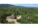 A beautiful mountain view property with a well-maintained home and detached garage on a serene lot at 8821 S Perry Park Rd, Larkspur, CO 80118