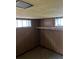 Cozy basement storage area with wood paneled walls and shelving at 2134 S Corona St, Denver, CO 80210