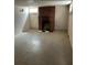 Open basement area with brick fireplace and a window for natural light at 2134 S Corona St, Denver, CO 80210