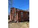 Rear view of the brick home showcasing its classic architecture and backyard setting at 2134 S Corona St, Denver, CO 80210