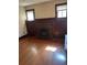 Charming living room with hardwood floors, a brick fireplace and built-in cabinets at 2134 S Corona St, Denver, CO 80210