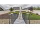 Landscaped backyard featuring a charming bridge and well-maintained lawn at 12749 Horton Ct, Parker, CO 80134