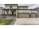 Two-story home with neutral siding, a multi-car garage, and a covered front porch at 12749 Horton Ct, Parker, CO 80134