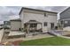 Home's exterior showcasing backyard with gazebo, bridge, and outdoor living space at 12749 Horton Ct, Parker, CO 80134