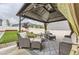 Cozy backyard gazebo with outdoor seating area and manicured lawn at 12749 Horton Ct, Parker, CO 80134
