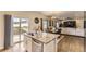 Kitchen island with granite countertops and stainless steel appliances plus a large dining area at 12749 Horton Ct, Parker, CO 80134