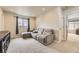 Cozy living room with a large sectional sofa, window, and plush carpeting at 12749 Horton Ct, Parker, CO 80134