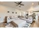 Comfortable living area with a large sectional sofa and an open concept design at 12749 Horton Ct, Parker, CO 80134