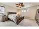 Bright bedroom with natural light and wood bedroom set at 12749 Horton Ct, Parker, CO 80134