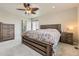 Comfortable bedroom with wood furnishings and decorative ceiling fan at 12749 Horton Ct, Parker, CO 80134