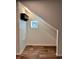 A cozy attic nook is illuminated by a small window, adding charm to the unique space at 5060 N Walden Way, Denver, CO 80249
