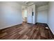 A simple bedroom design shows wood flooring, white walls, and a closet with ample storage space at 5060 N Walden Way, Denver, CO 80249