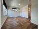 Spacious bedroom with wood-look floors and a modern design, flooded with natural light at 5060 N Walden Way, Denver, CO 80249