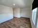 Cozy bedroom with wood-look flooring, plenty of natural light, and neutral walls for a serene ambiance at 5060 N Walden Way, Denver, CO 80249