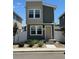 Charming two-story home with modern design, landscaped yard, and inviting front entrance at 5060 N Walden Way, Denver, CO 80249