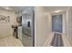Cozy kitchen features stainless steel appliances, tile flooring, and bright, light blue cabinetry at 1777 Larimer St # 2201, Denver, CO 80202