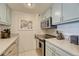 This efficient kitchen features stainless steel appliances, updated cabinetry, and neutral countertops at 1777 Larimer St # 2201, Denver, CO 80202