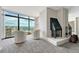 Cozy living room showcasing a fireplace, comfortable seating, and expansive city views at 1777 Larimer St # 2201, Denver, CO 80202
