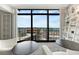 Modern living room featuring floor-to-ceiling windows with city views and sleek decor at 1777 Larimer St # 2201, Denver, CO 80202