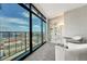 Bright living area with floor-to-ceiling windows offering panoramic city views and modern furnishings at 1777 Larimer St # 2201, Denver, CO 80202