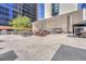 Outdoor kitchen and lounge area with grills, dining and seating, set against a skyline of buildings at 1777 Larimer St # 2201, Denver, CO 80202