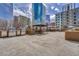 Outdoor kitchen featuring grills and dining gazebos set against a backdrop of downtown buildings at 1777 Larimer St # 2201, Denver, CO 80202
