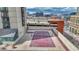 Rooftop recreation area featuring a basketball court and tennis court, with city views at 1777 Larimer St # 2201, Denver, CO 80202